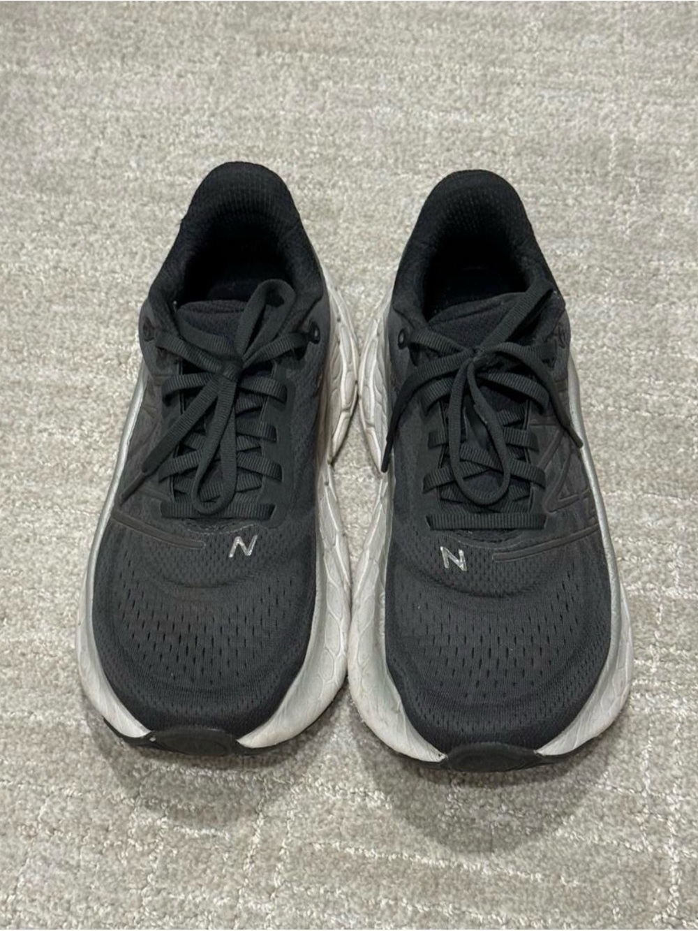 New Balance women's dark gray Athletic Sneakers with White Soles